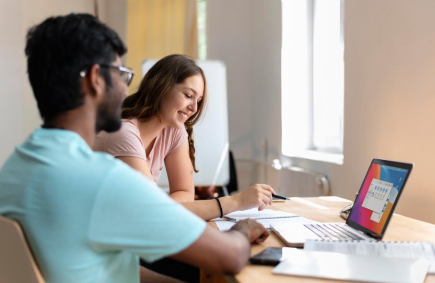 Team collaboration session discussing budget features